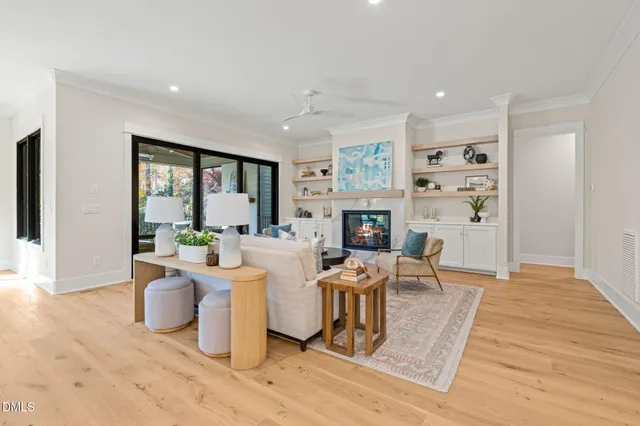 a kitchen with stainless steel appliances granite countertop a kitchen island a stove and a wooden floors