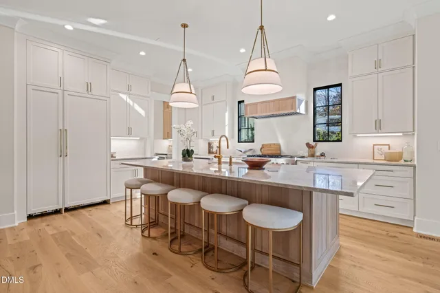 a spacious bathroom with a granite countertop sink and a mirror