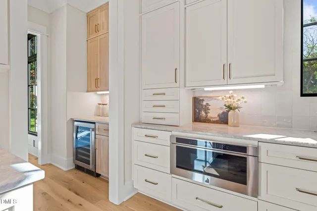 a spacious bathroom with a bathtub and next to a window