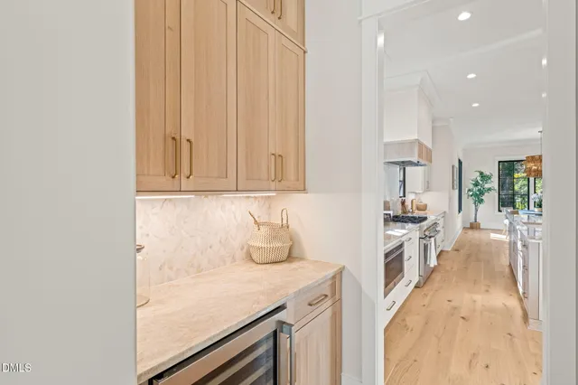 a living room with patio fireplace furniture and a large window