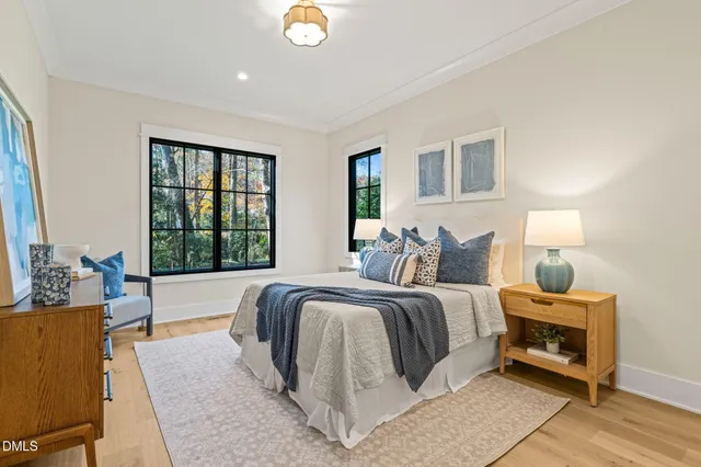 a living room with a fireplace and a potted plant