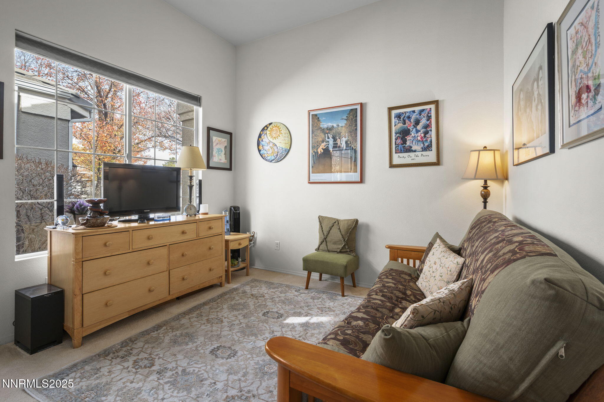 9721 Ripple Way Reno, NV 89521 - Photo 12 of 22 a living room with furniture cabinets and a flat screen tv