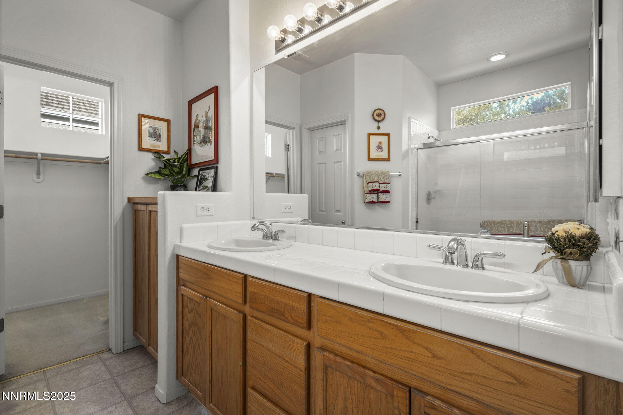 9721 Ripple Way Reno, NV 89521 - Photo 13 of 22 a bathroom with double sink and a mirror