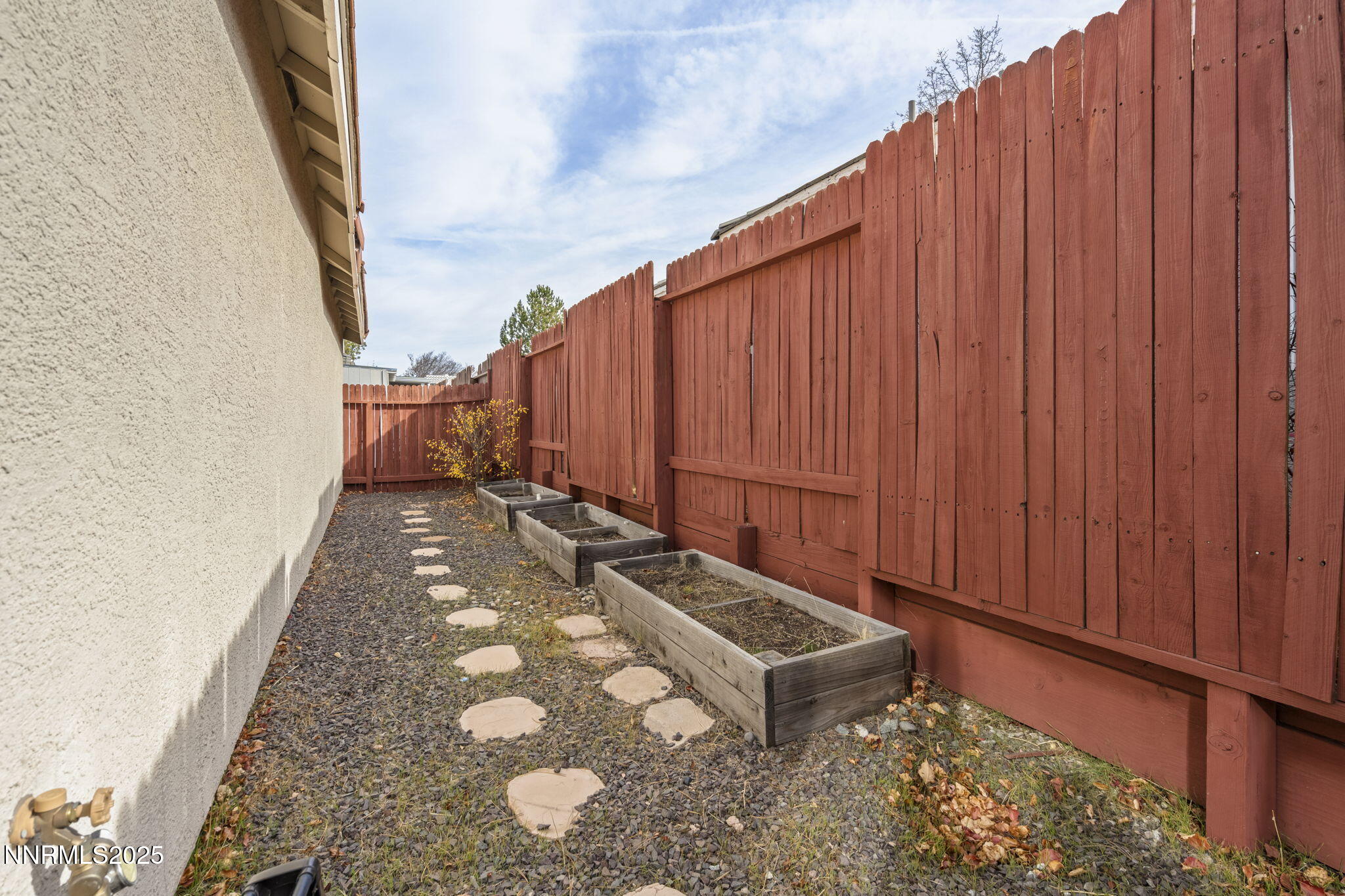 9721 Ripple Way Reno, NV 89521 - Photo 16 of 22 a view of a backyard with wooden fence