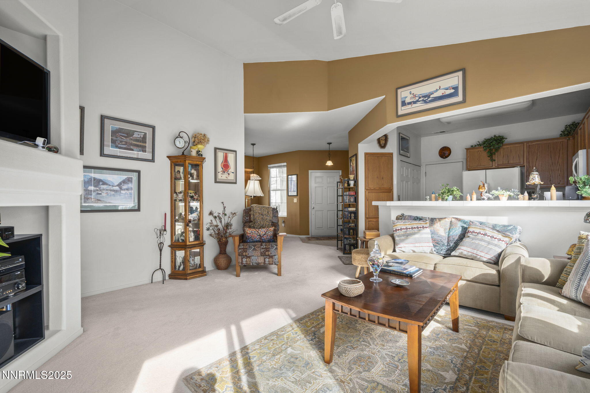 9721 Ripple Way Reno, NV 89521 - Photo 3 of 22 a living room with furniture and a flat screen tv