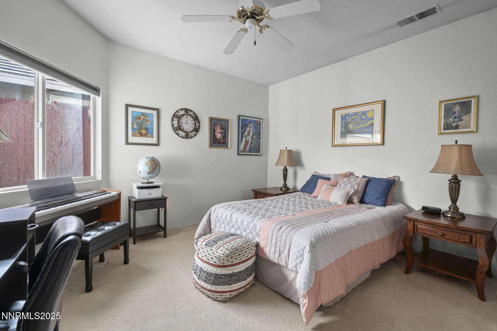 9721 Ripple Way Reno, NV 89521 - Photo 10 of 22 a bedroom with a bed and a chandelier