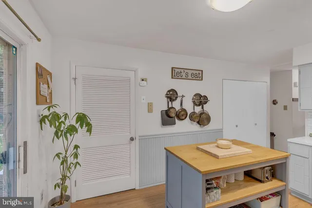 a room with furniture and paintings on the wall