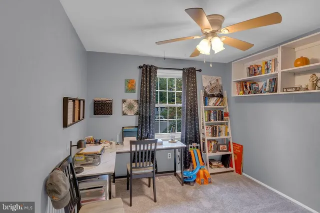 a dining room with furniture and a chandelier