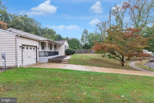 a view of a yard with a house and a garden