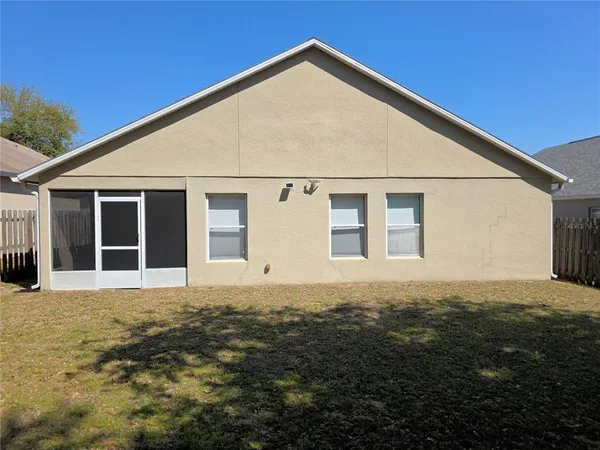 a view of a backyard of the house