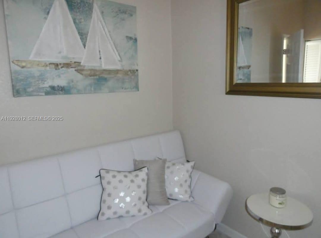 2228 Polk Street, Unit 7 Hollywood, FL 33020 - Photo 13 of 14 a view of table and chair