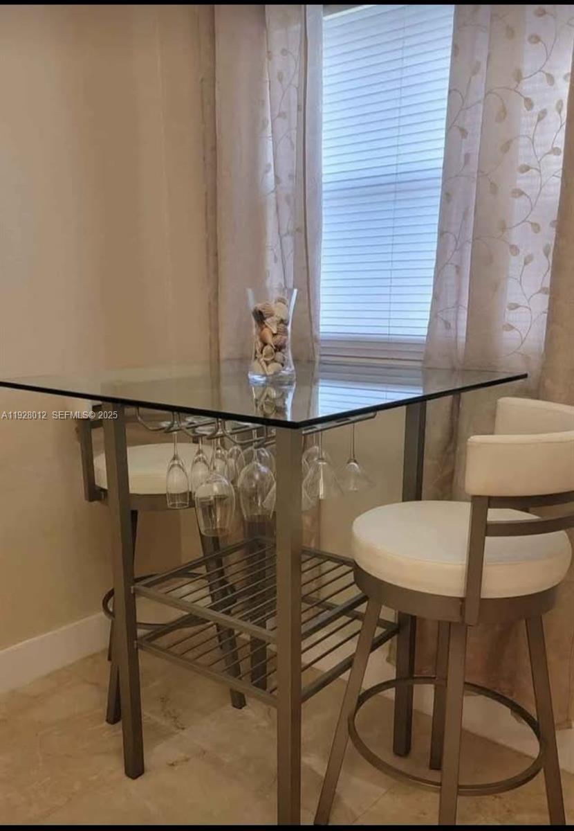 2228 Polk Street, Unit 7 Hollywood, FL 33020 - Photo 3 of 14 a bathroom with a sink and a mirror