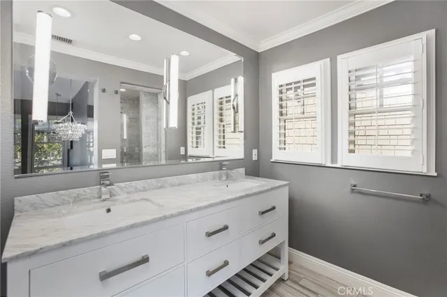 a bathroom with a sink and a window