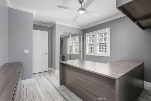 a view of kitchen and hall with wooden floor