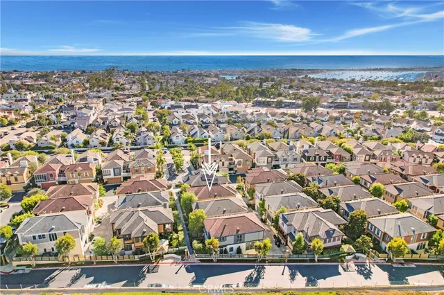 an aerial view of residential building with green space