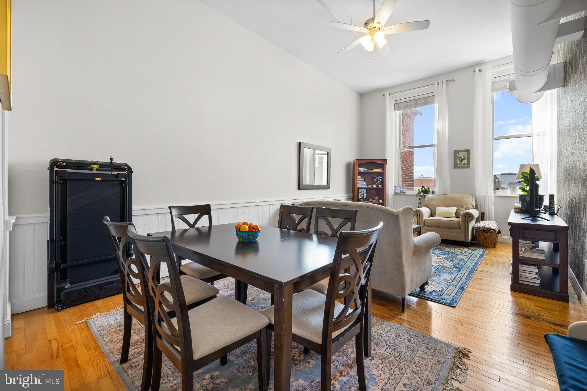 511 South Bond Street, Unit 302 Baltimore, MD 21231 - Photo 11 of 24 a view of a dining room with furniture and wooden floor