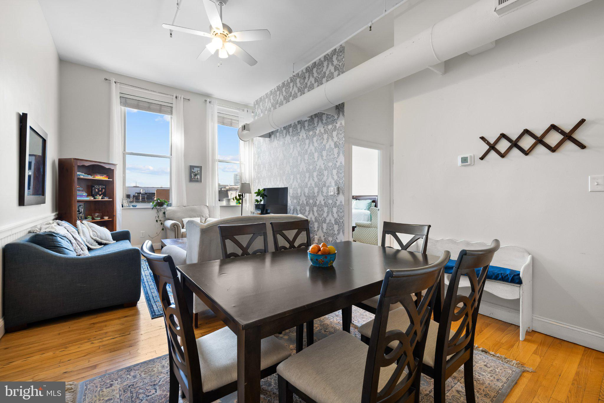 511 South Bond Street, Unit 302 Baltimore, MD 21231 - Photo 12 of 24 a view of a dining room with furniture and wooden floor