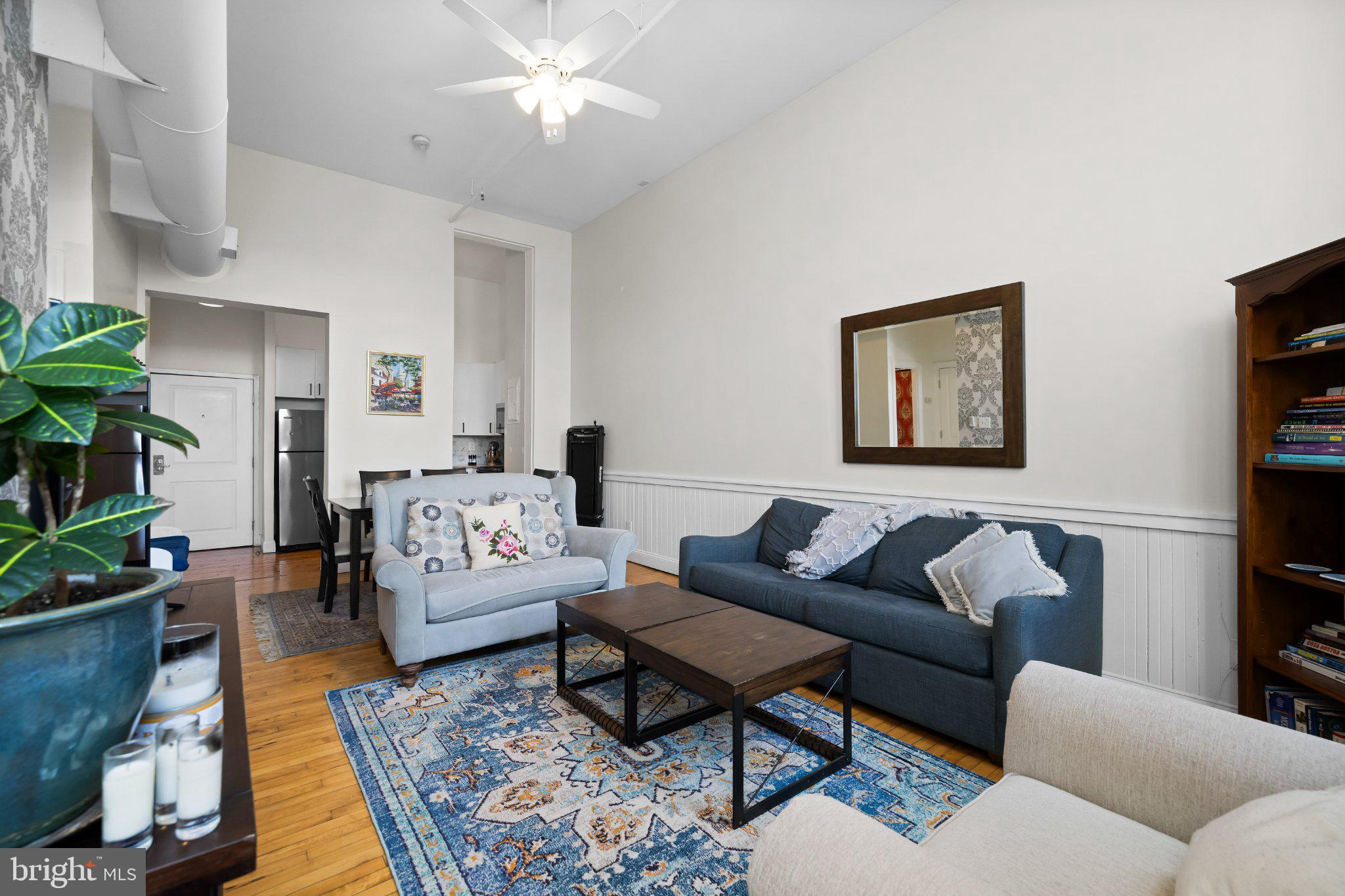 511 South Bond Street, Unit 302 Baltimore, MD 21231 - Photo 14 of 24 a living room with furniture and a rug