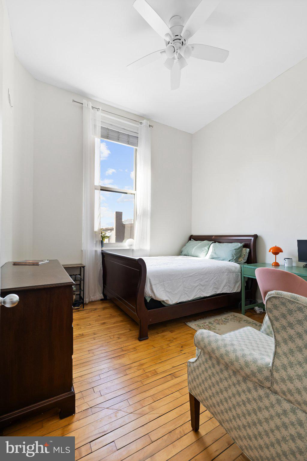 511 South Bond Street, Unit 302 Baltimore, MD 21231 - Photo 20 of 24 a bedroom with a bed and wooden floor