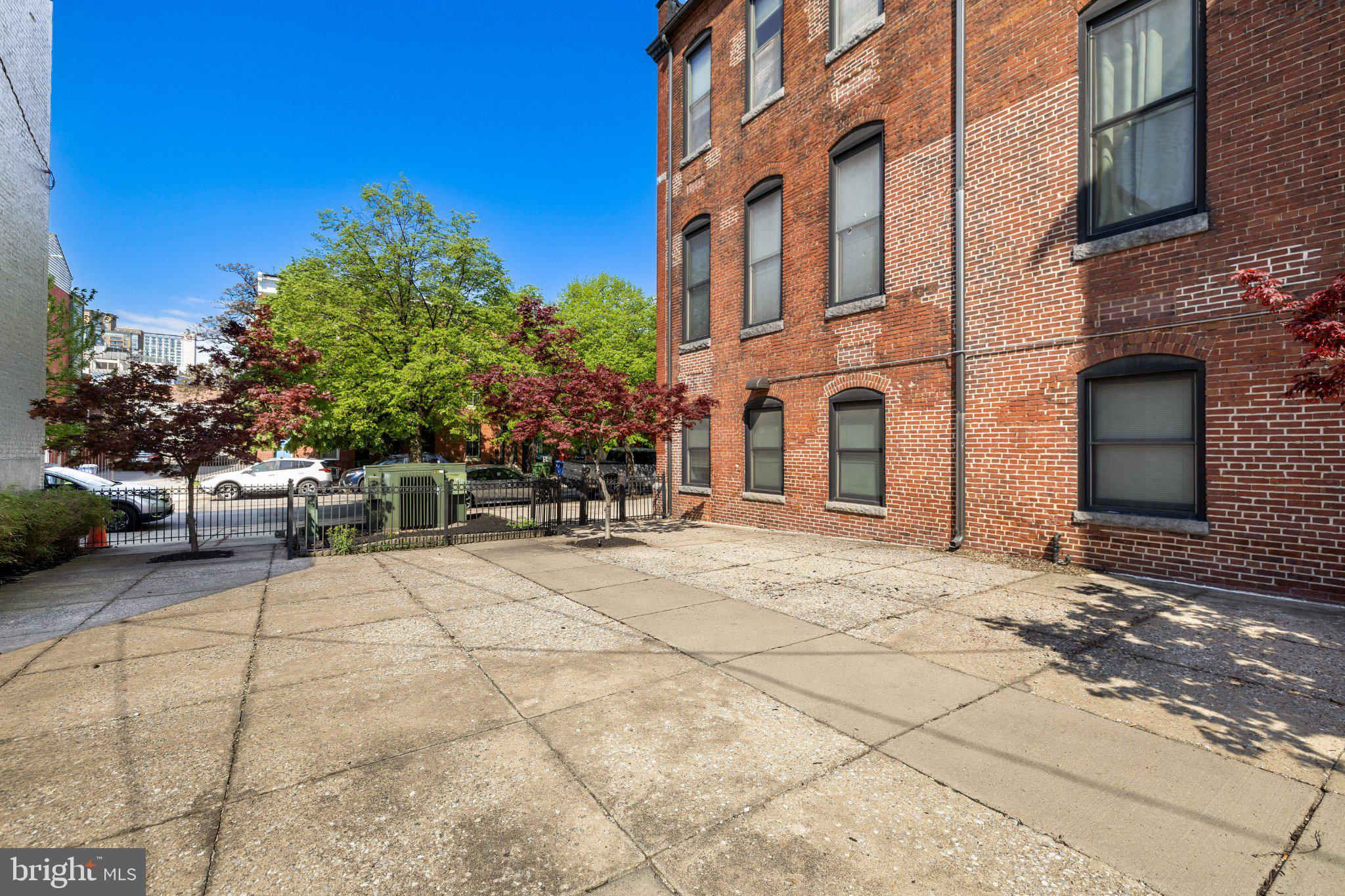 511 South Bond Street, Unit 302 Baltimore, MD 21231 - Photo 21 of 24 a building with trees in front of it