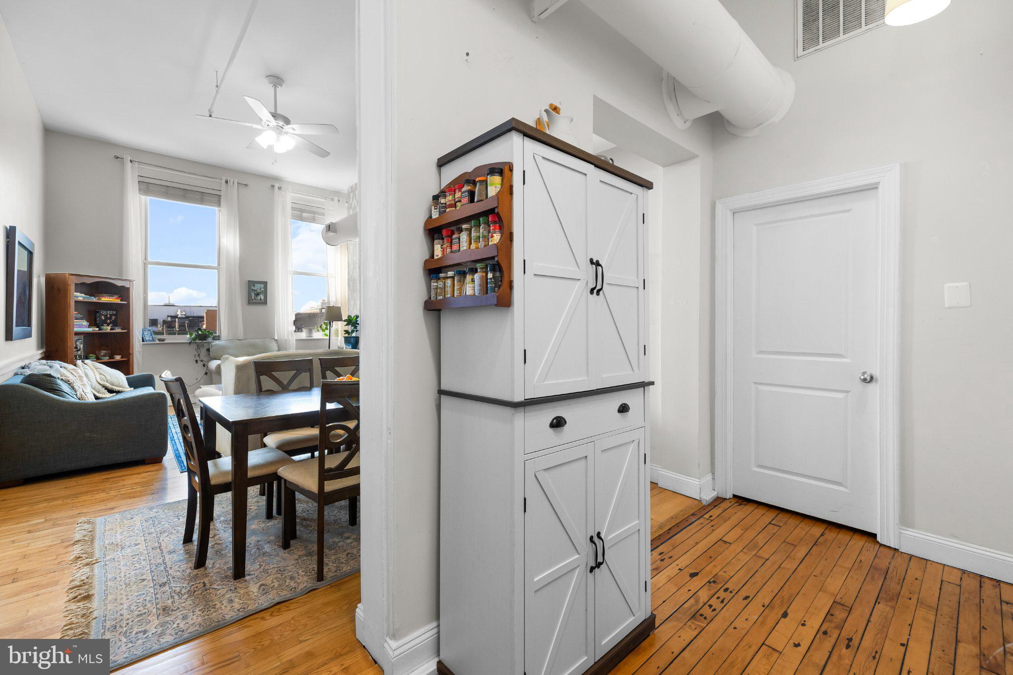 511 South Bond Street, Unit 302 Baltimore, MD 21231 - Photo 6 of 24 a workspace with furniture and wooden floor