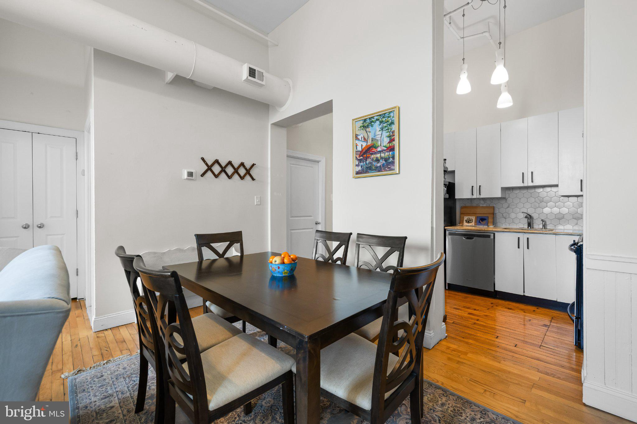 511 South Bond Street, Unit 302 Baltimore, MD 21231 - Photo 10 of 24 a view of a dining room with furniture and wooden floor