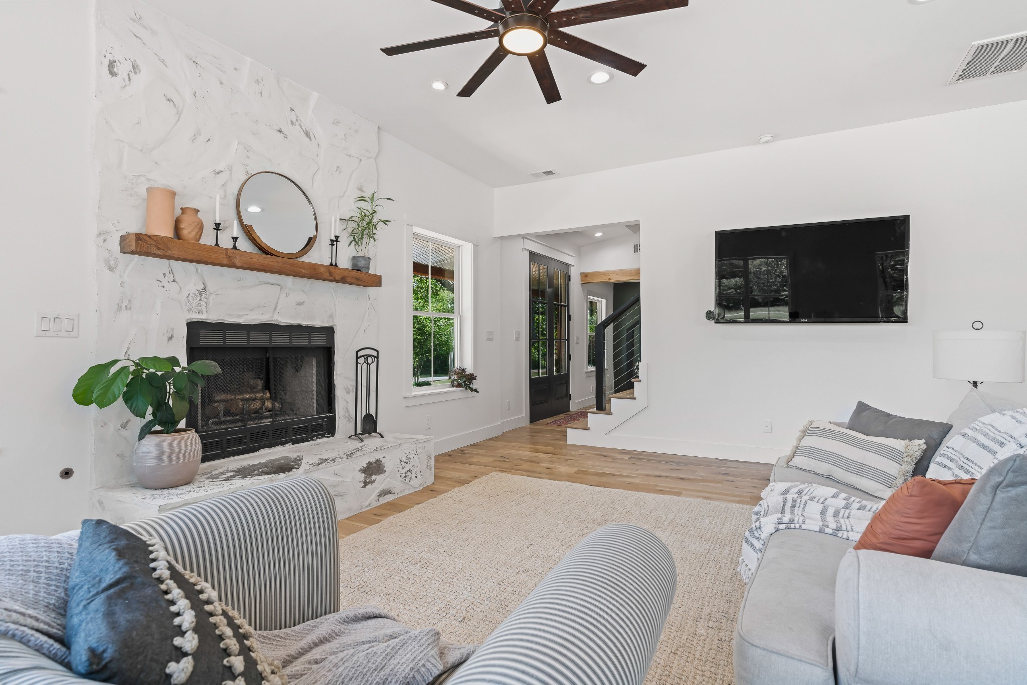 3322 Franklin Road Lebanon, TN 37090 - Photo 19 of 63 a living room with furniture a flat screen tv and a fireplace