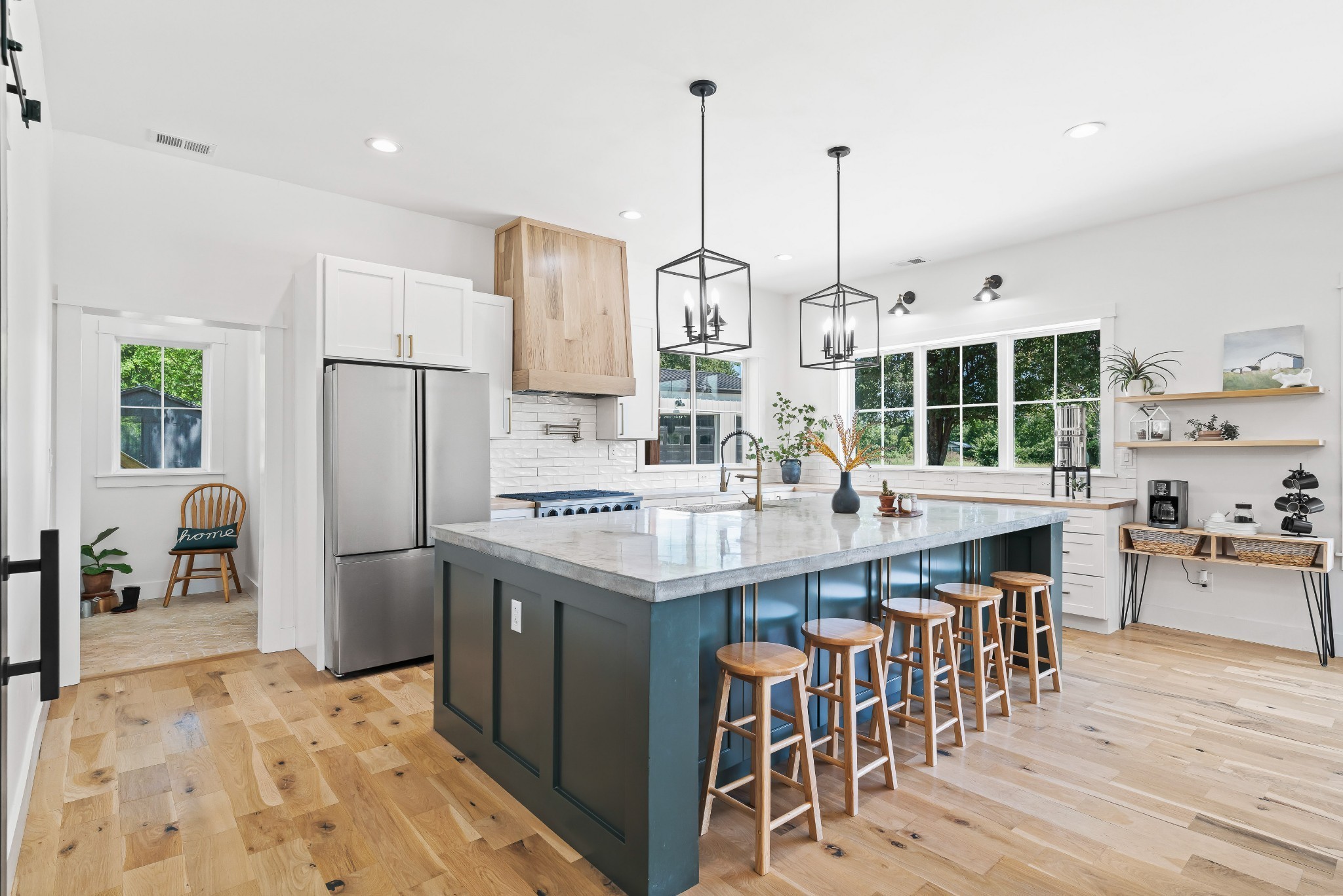 3322 Franklin Road Lebanon, TN 37090 - Photo 23 of 63 a kitchen with stainless steel appliances kitchen island granite countertop a table chairs and a stove