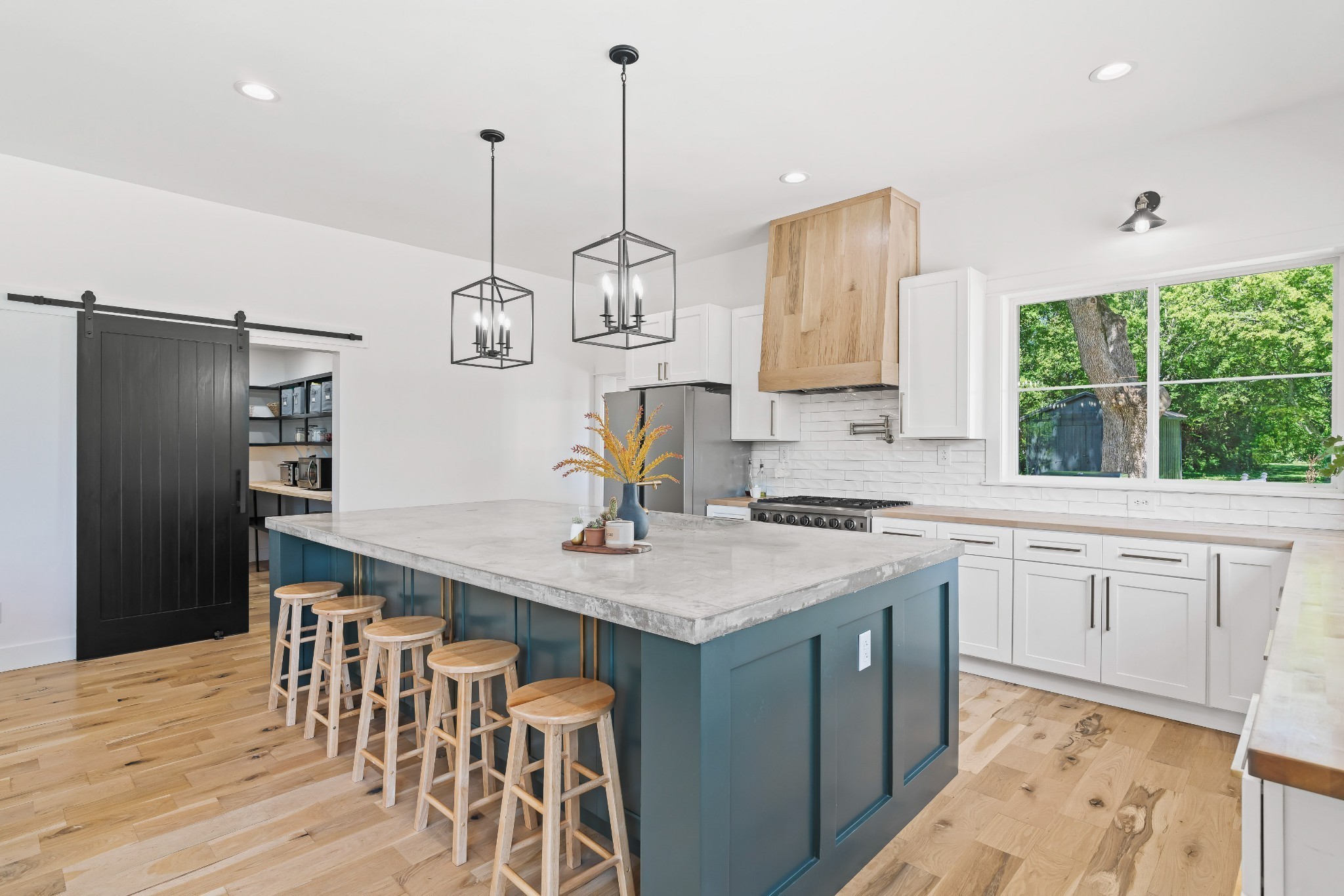 3322 Franklin Road Lebanon, TN 37090 - Photo 27 of 63 a kitchen with stainless steel appliances granite countertop a sink a stove a refrigerator and island with wooden floor