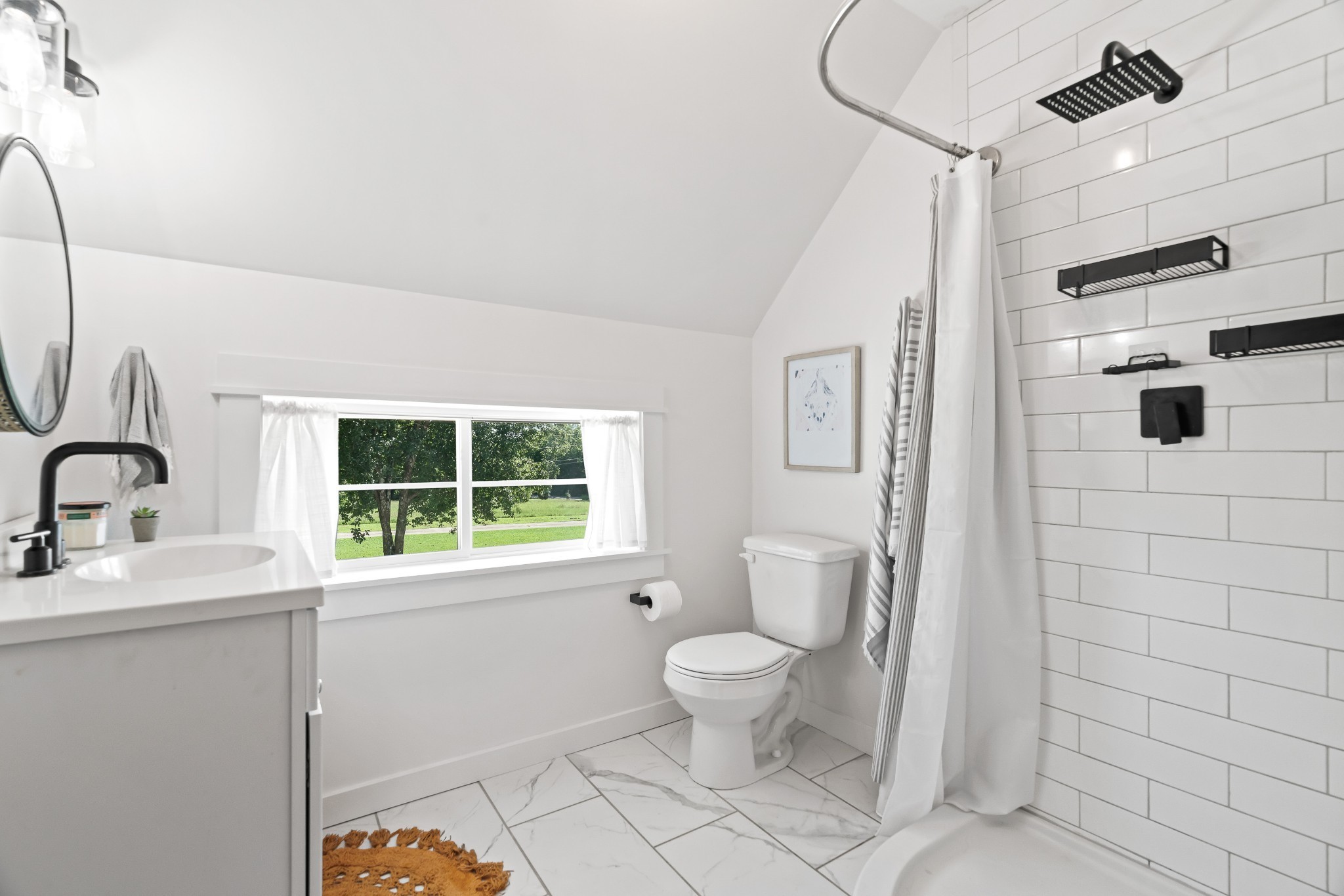 3322 Franklin Road Lebanon, TN 37090 - Photo 45 of 63 a bathroom with a toilet sink a mirror and next to a window