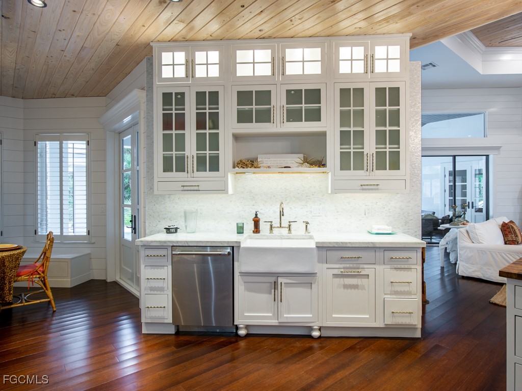 2388 Wulfert Road Sanibel, FL 33957 - Photo 15 of 49 a kitchen with a stove a sink and cabinets
