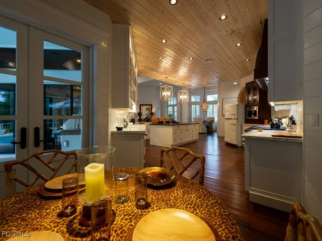 a bedroom with furniture and a large window