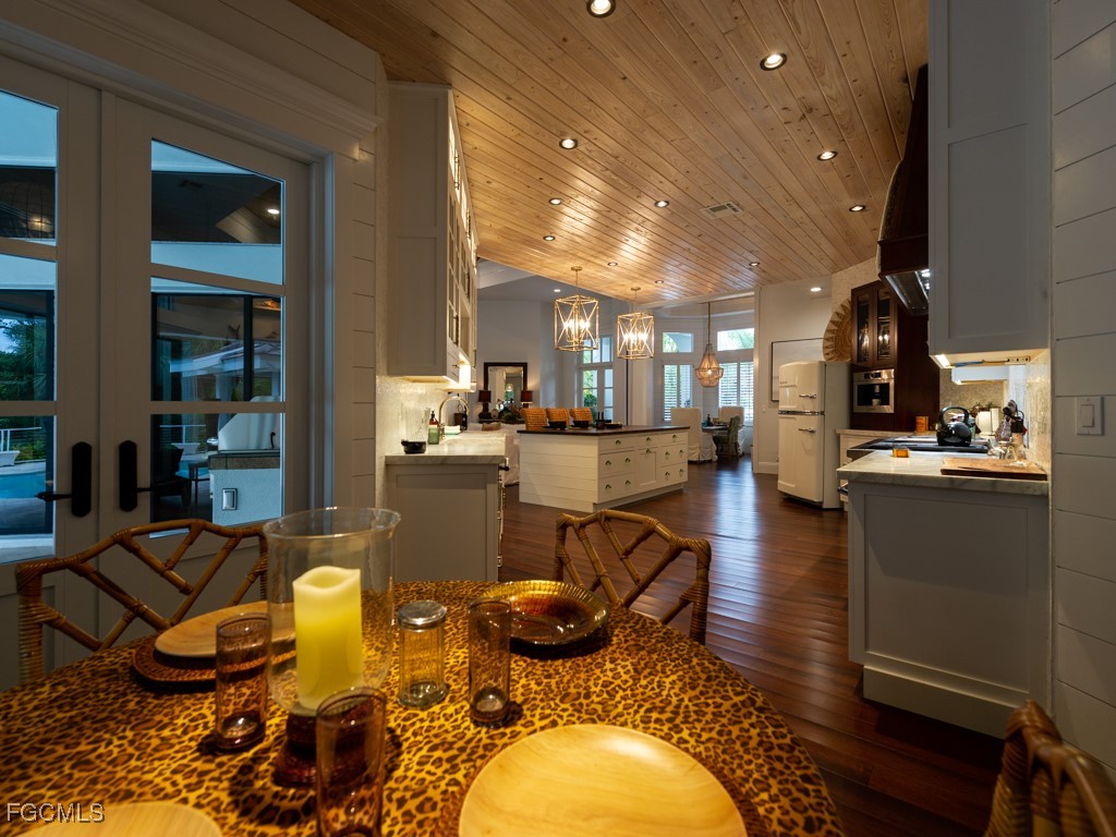2388 Wulfert Road Sanibel, FL 33957 - Photo 16 of 49 a living room with dining room and kitchen view