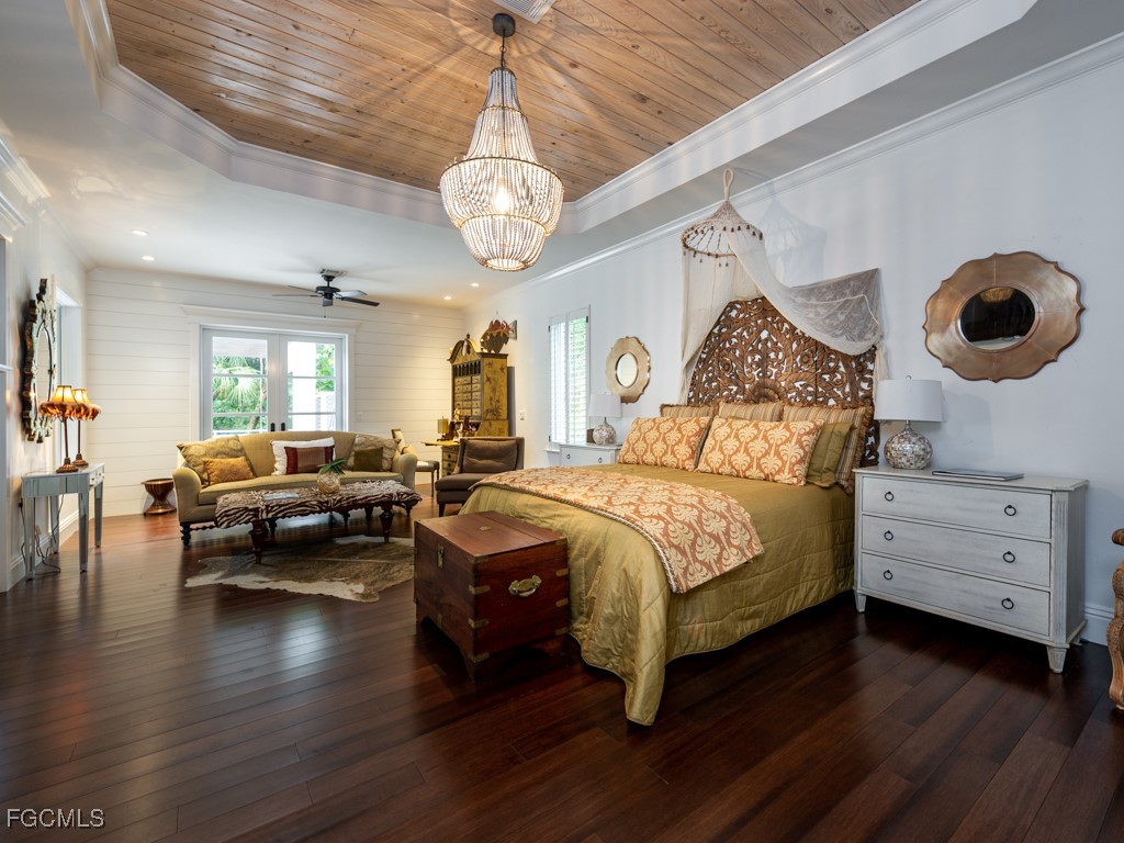 2388 Wulfert Road Sanibel, FL 33957 - Photo 18 of 49 a bedroom with furniture and a large window