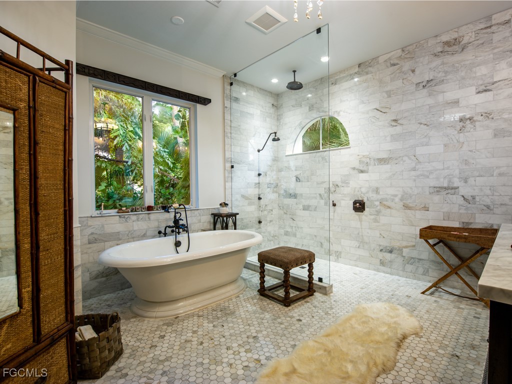 2388 Wulfert Road Sanibel, FL 33957 - Photo 23 of 49 a living room with patio furniture and a fireplace