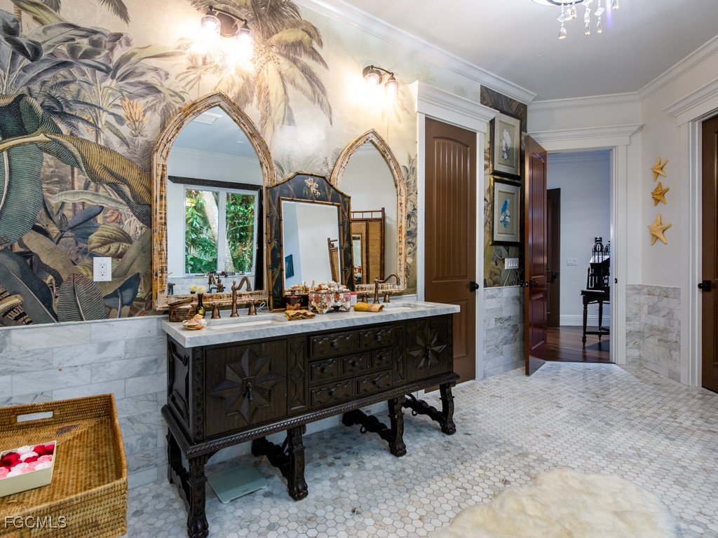 2388 Wulfert Road Sanibel, FL 33957 - Photo 24 of 49 a view of hall way with furniture and chandelier