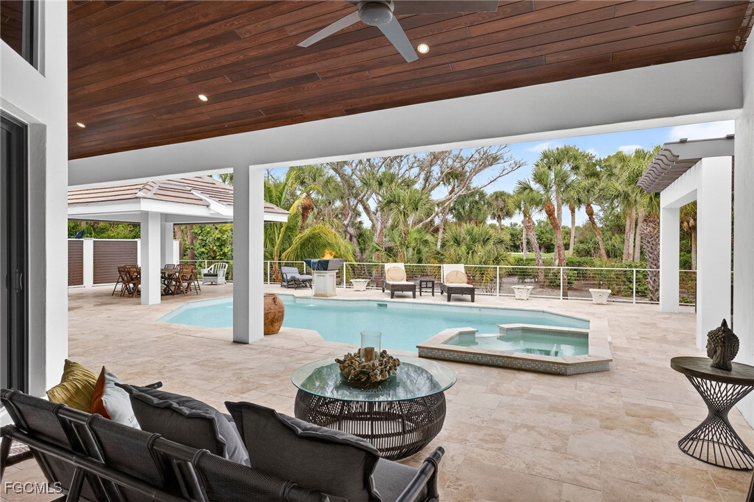 2388 Wulfert Road Sanibel, FL 33957 - Photo 31 of 50 a living room with furniture and a large window