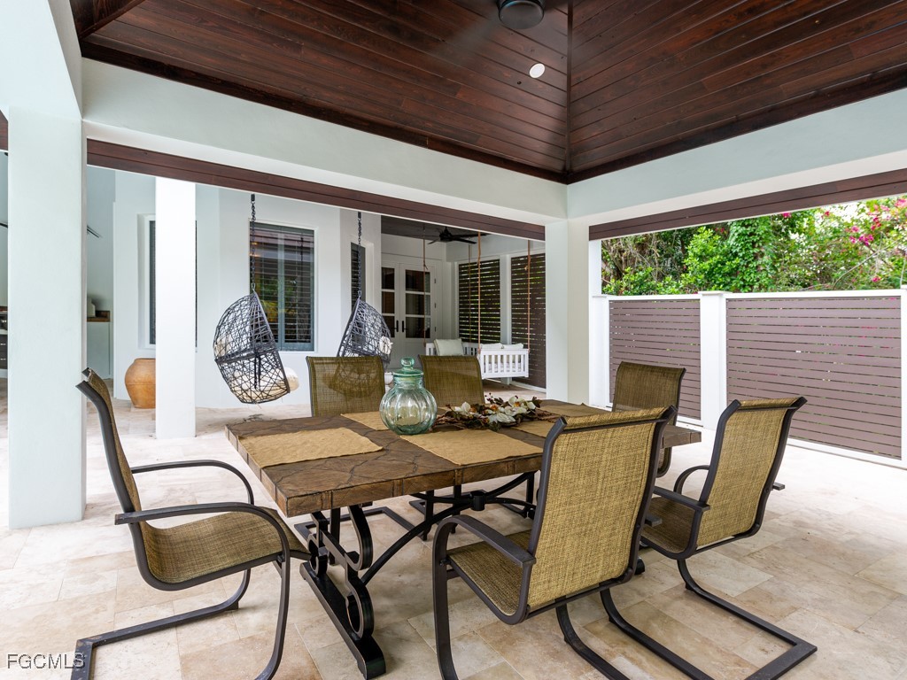 2388 Wulfert Road Sanibel, FL 33957 - Photo 34 of 49 a view of a patio with table and chairs