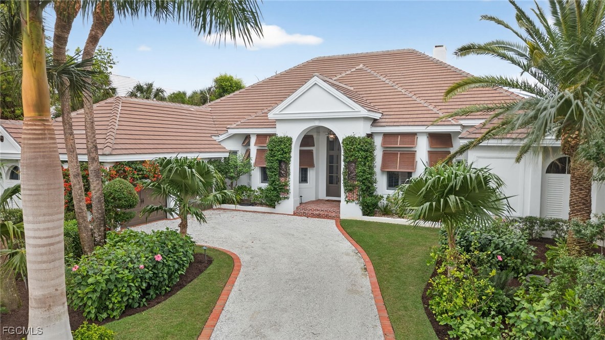 2388 Wulfert Road Sanibel, FL 33957 - Photo 41 of 50 front view of a house with a yard