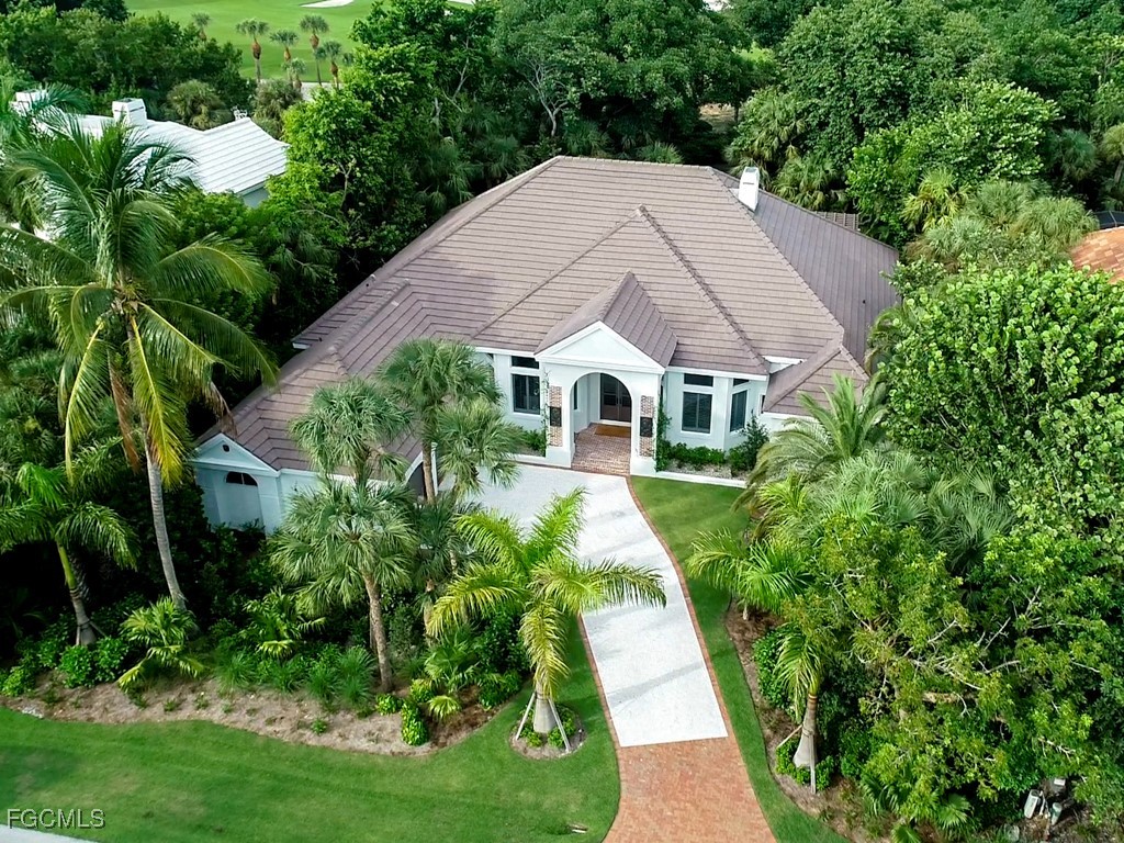 2388 Wulfert Road Sanibel, FL 33957 - Photo 45 of 49 a aerial view of a house with a yard and sitting area