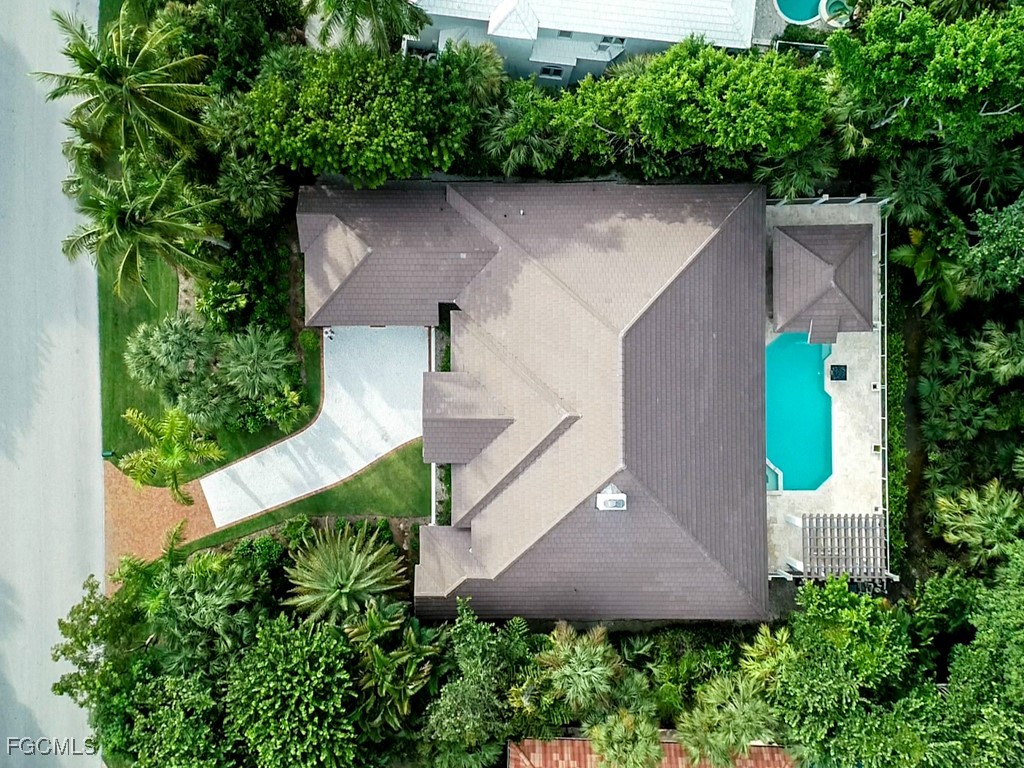 2388 Wulfert Road Sanibel, FL 33957 - Photo 47 of 49 an aerial view of a house with a yard and plants