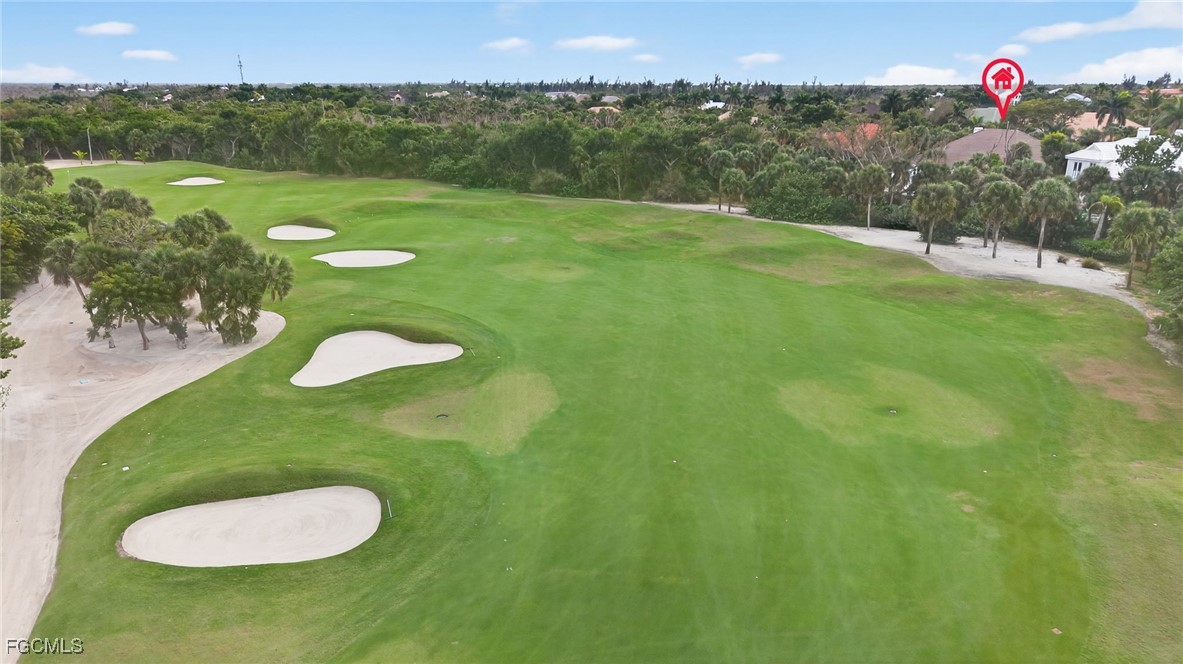 2388 Wulfert Road Sanibel, FL 33957 - Photo 50 of 50 a view of a golf course with a lake