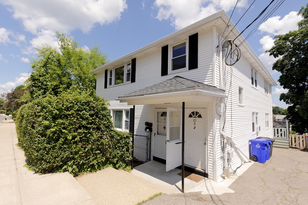 89 Brayton Road, Unit 2 Boston, MA 02135 - Photo 17 of 29 a view of a house with a backyard