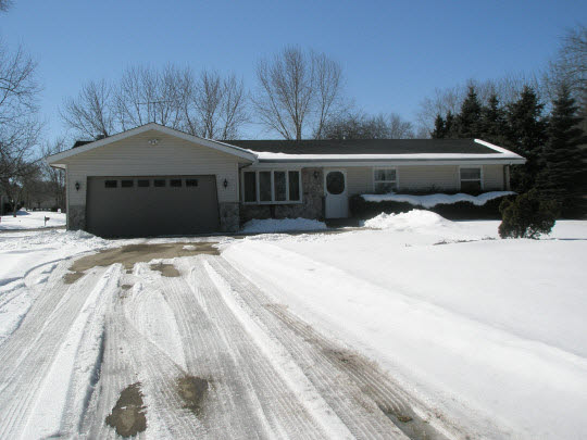2523 Spring Creek Road Belvidere, IL 61008 - Photo 1 of 10 a front view of house with yard covered in snow