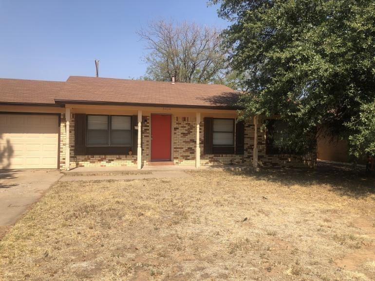 5424 45th Street Lubbock, TX 79414 - Photo 2 of 16 front view of a house with a yard