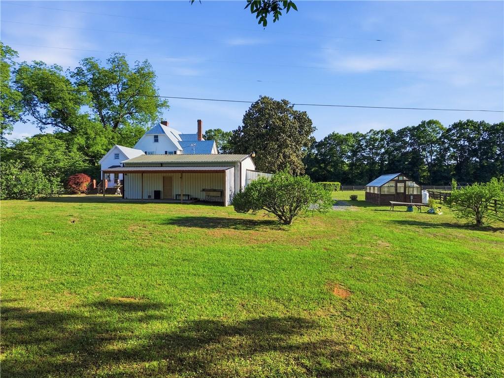 880 Johnstonville Road Barnesville, GA 30204 - Photo 6 of 33 a front view of a house with garden