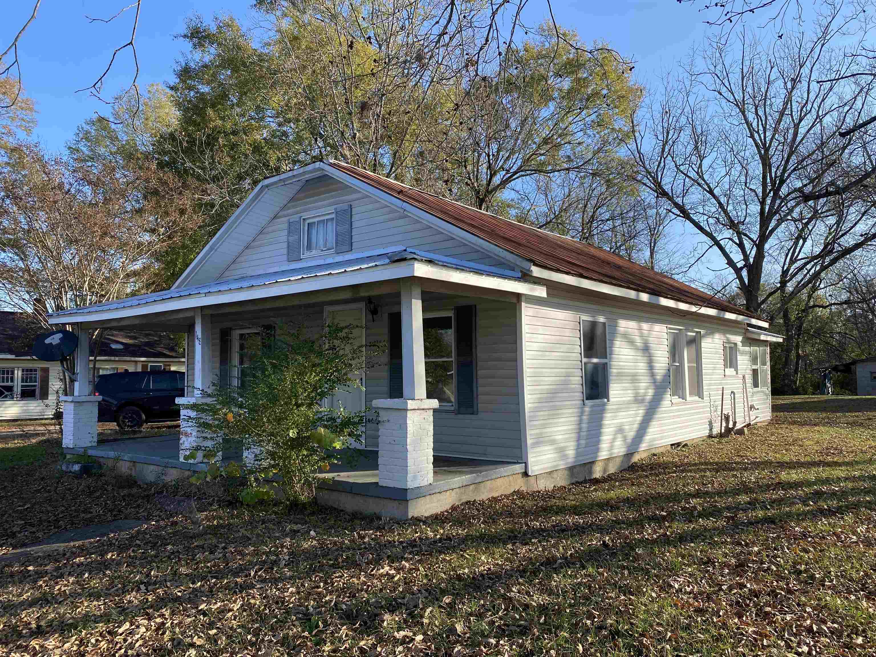 148 North Maple Street Adamsville, TN 38310 - Photo 1 of 1 a front view of a house with garden
