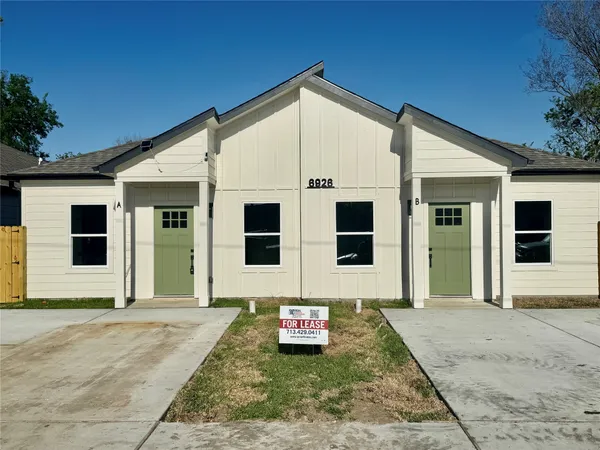 a view of a house with a garden