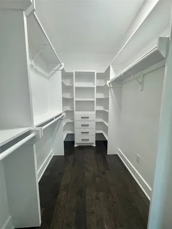 a view of an empty walk in closet