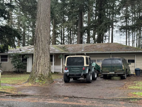a view of a car park in front of house